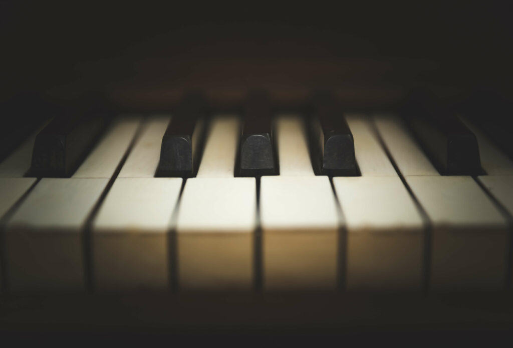 A close-up of piano keys with black and white keys softly in focus, making it easier for you to appreciate the delicate details important during musical instrument moves or removals.